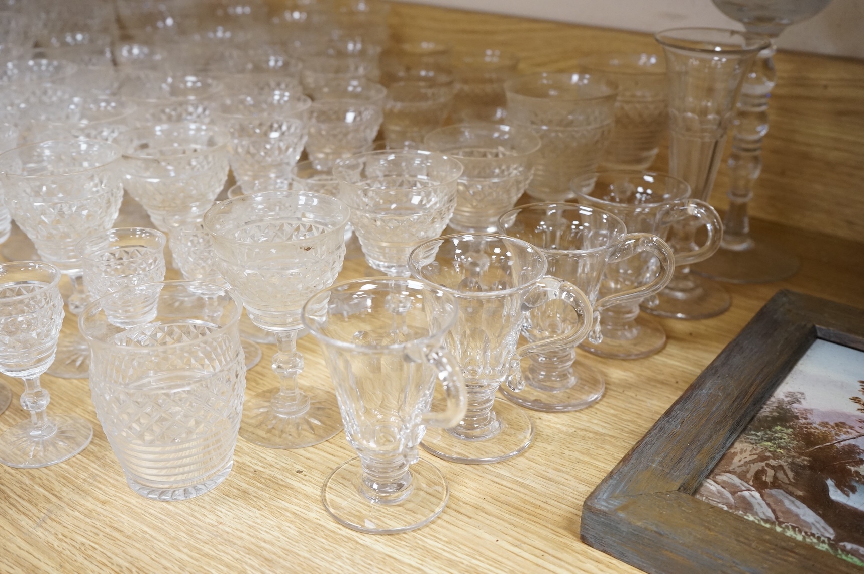 A suite of early 20th century cut table glass, custard glasses, a tall stemmed etched glass, etc., etched glass 24cm high
